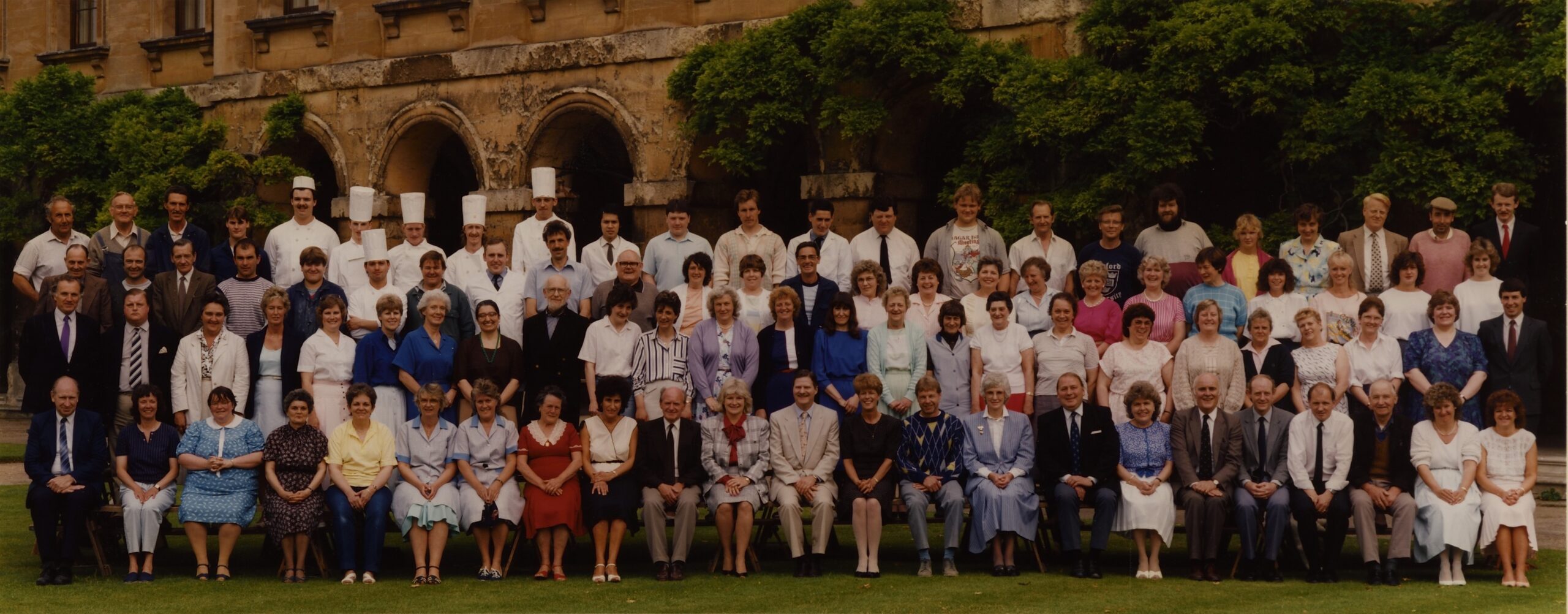 Formal colour photograph of Magdalen College staff with President Keith Griffin, 1988.